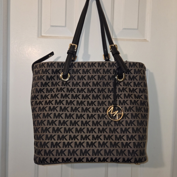 Michael Kors Handbags - Michael Kors: Gently Used Condition Signature Black and Tan Tote.